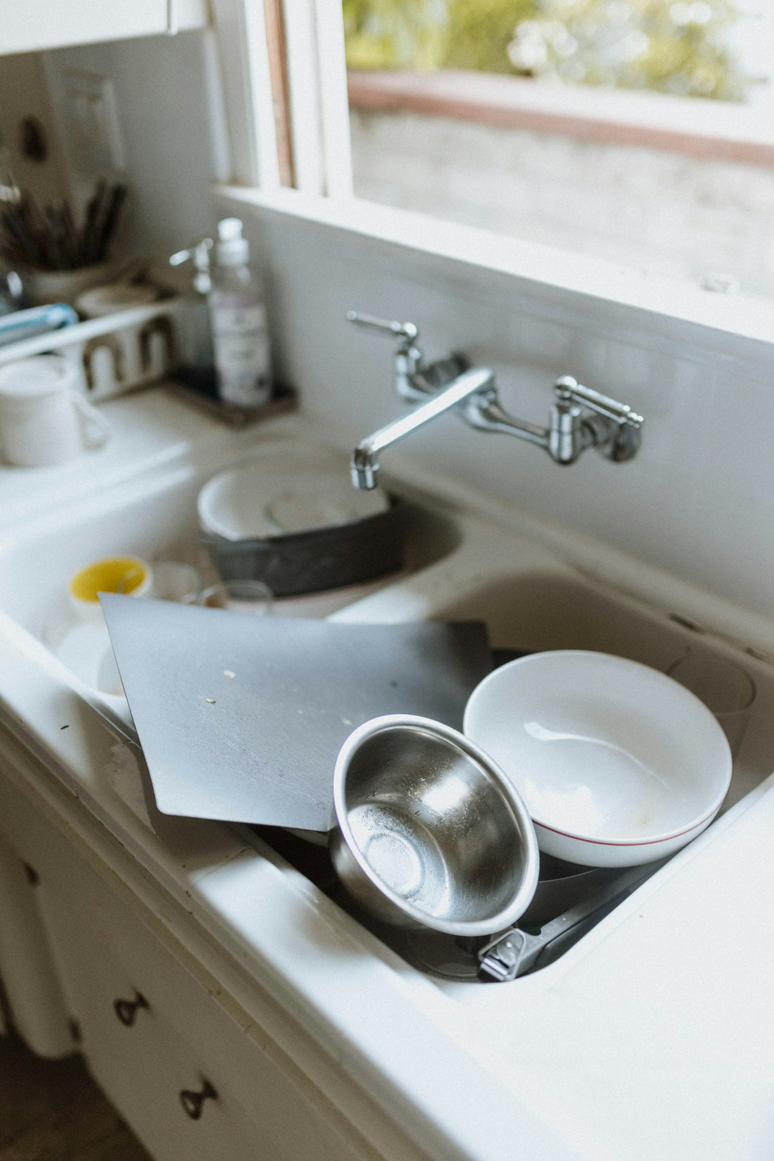 a sink with a couple of dishes on it