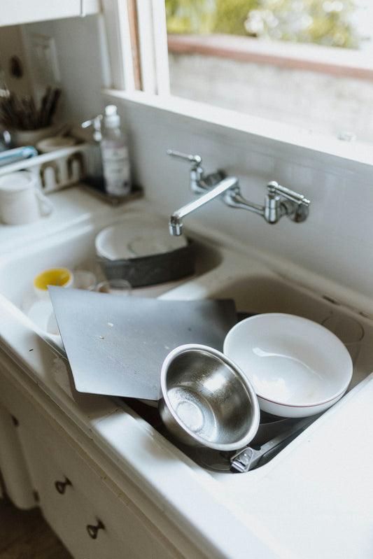 a sink with a couple of dishes on it