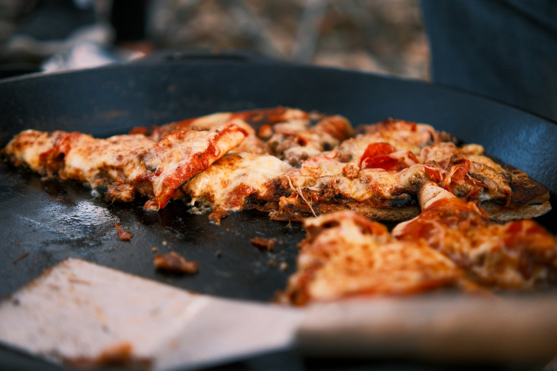 a half eaten pizza sitting on top of a pan