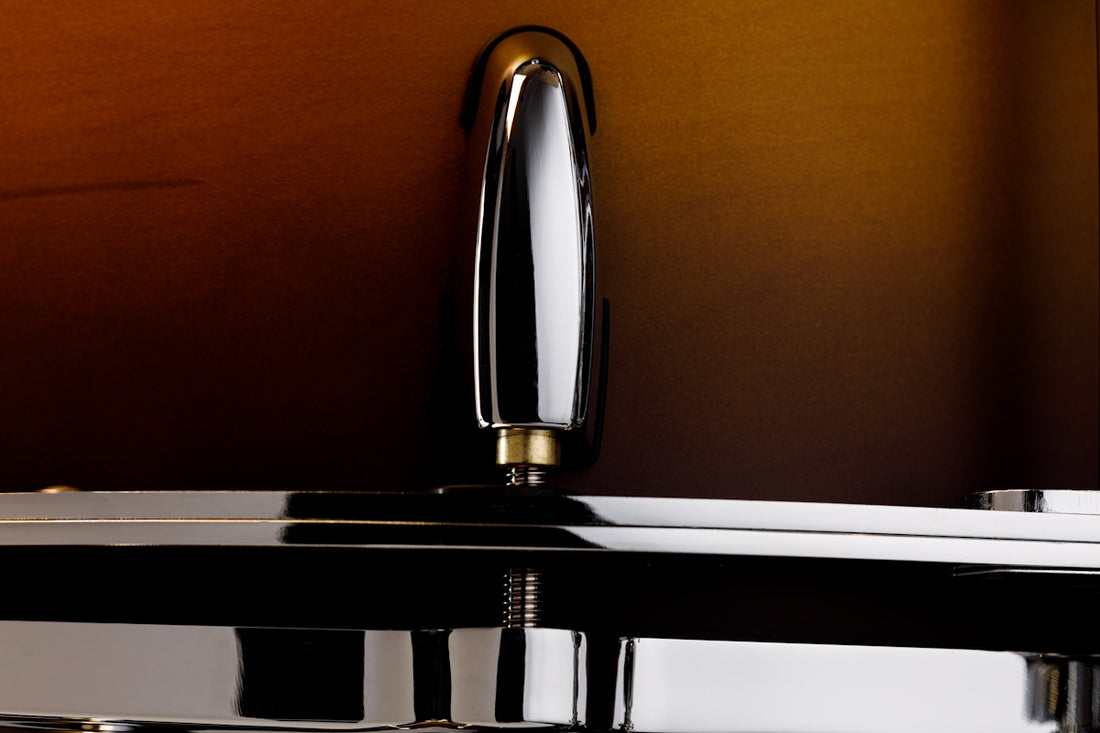 A close up of a shiny chrome sink faucet
